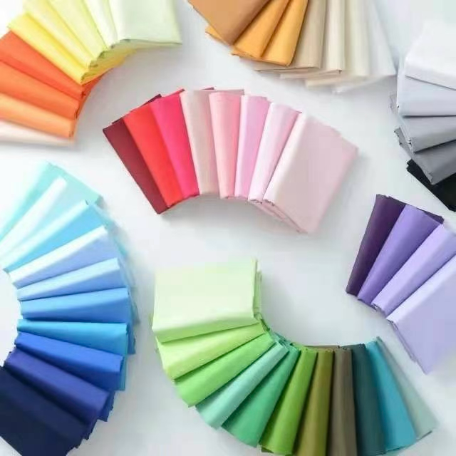 Fabric lab dip colour swatches arranged by shade family